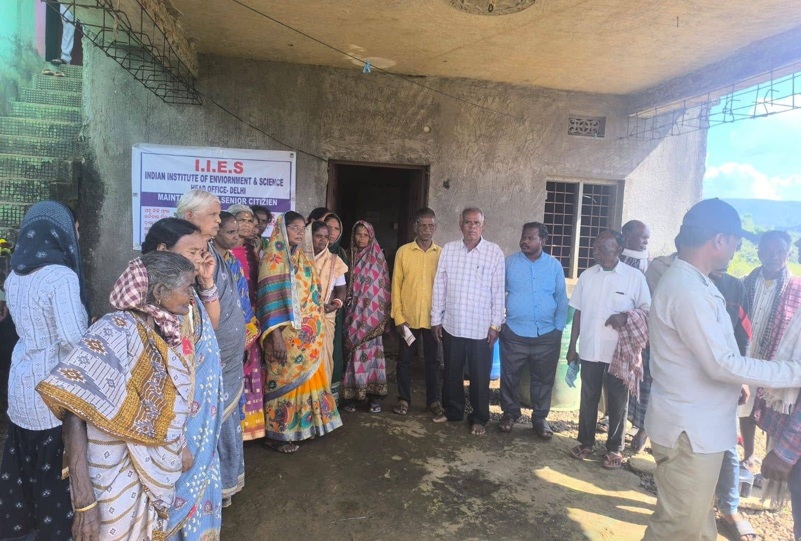 Residents and IIES field staff outside the senior citizens programme site